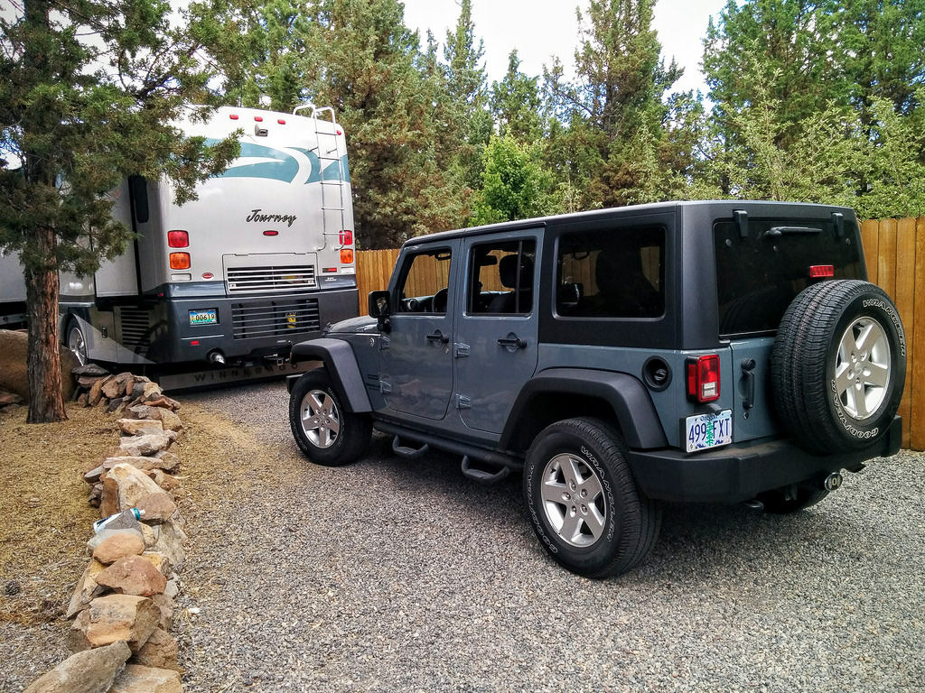 Journey and tow car parked in driveway
