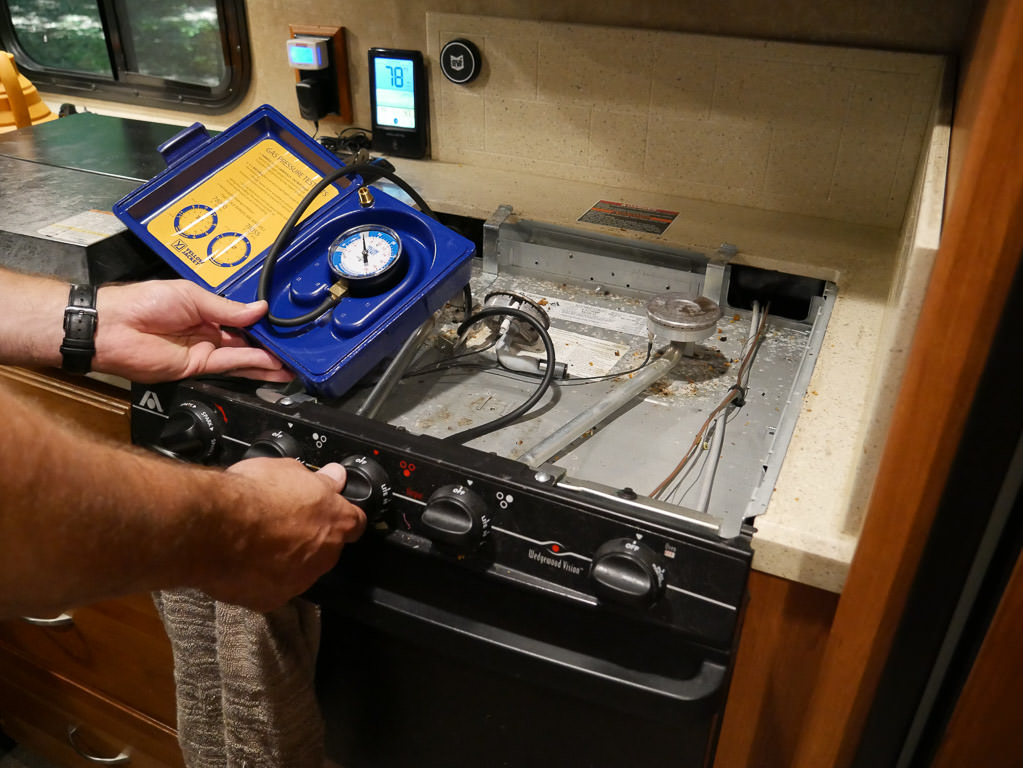 Kenny doing a propane leak test on the stovetop