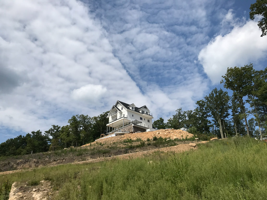 White house sitting on hill