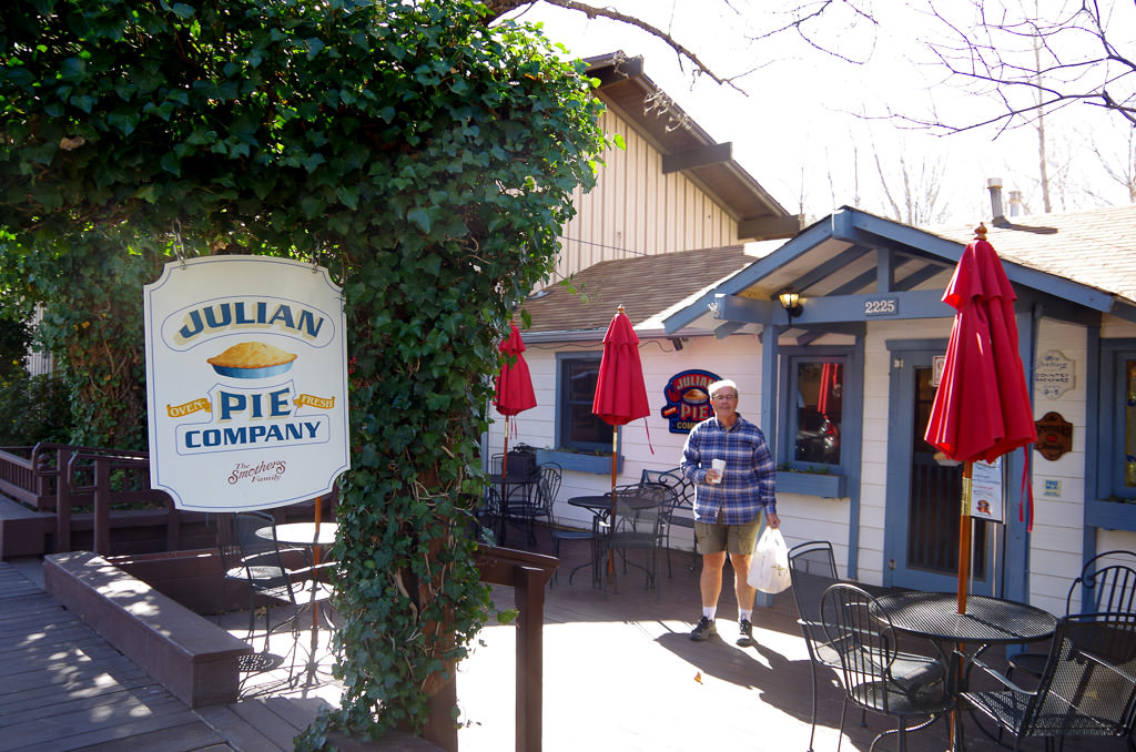 Man standing in front of Julian Pie Company.