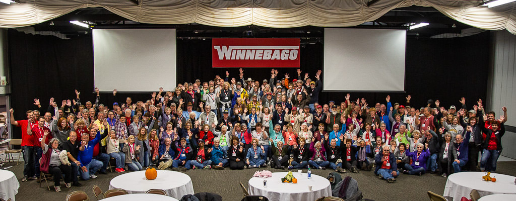 Large group of people posing for a photo at the Compact Coach rally