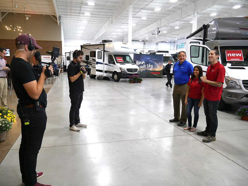 Film crew filming Russ Garfin and Jon and Nadia Bajuelo.