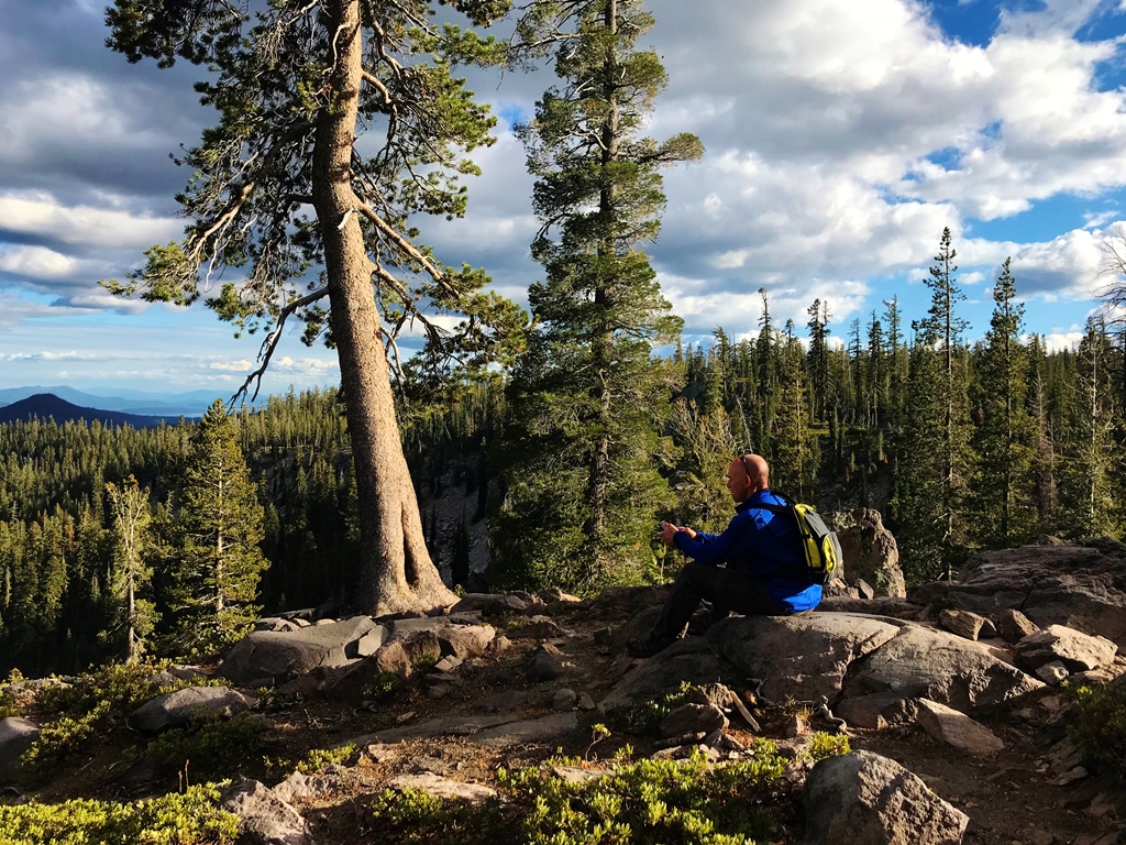 James in a work meeting sitting on the side of a volcano