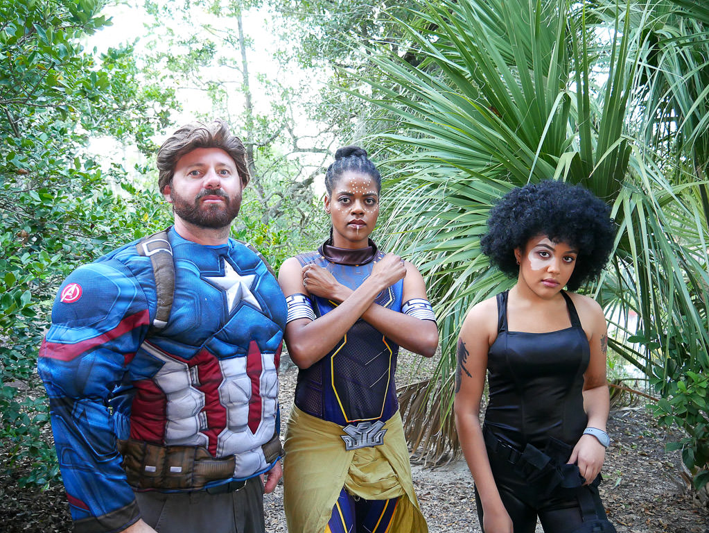 Kenny, Sabrina, and their niece in costume for a Halloween party.