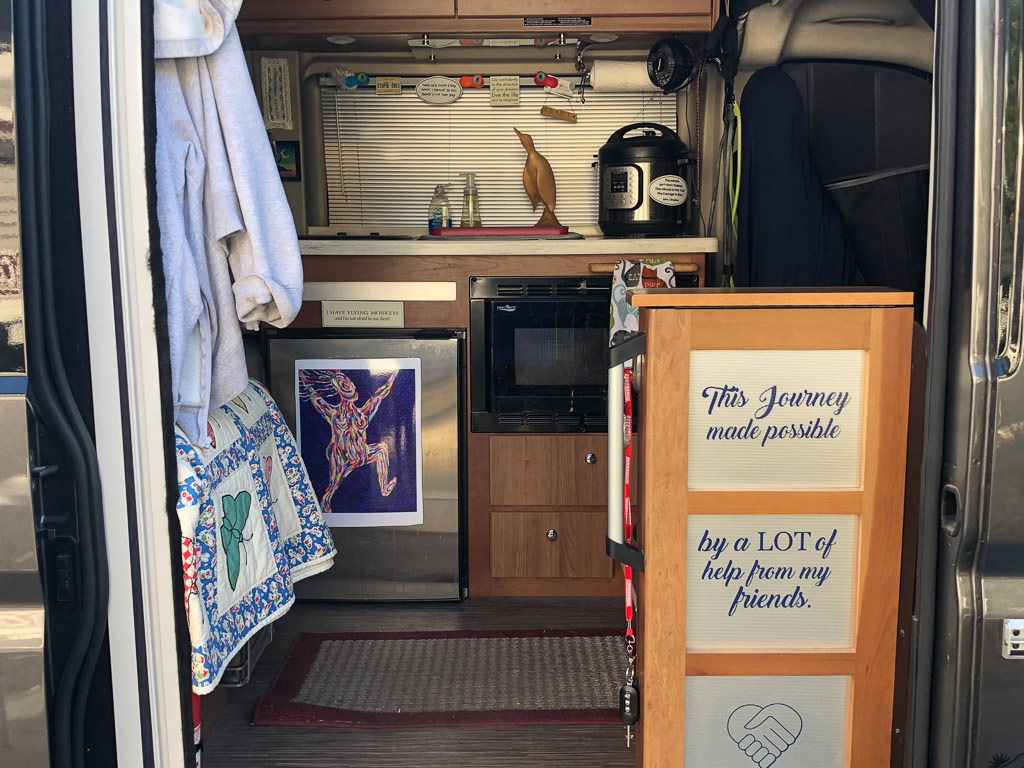 Looking inside side door of decorated Travato