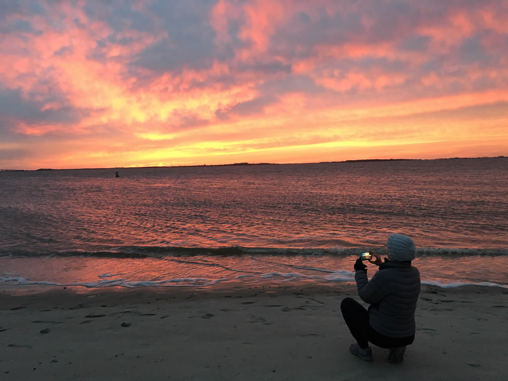 Orange sunset over ocean at beach