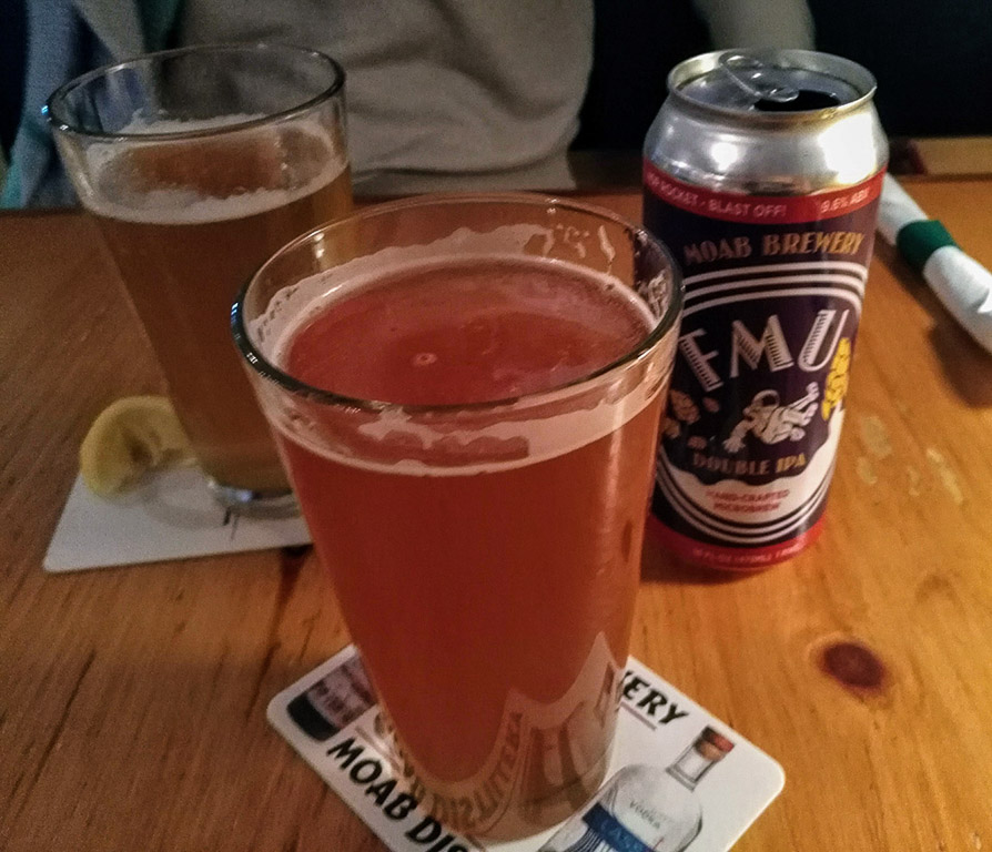 Three drinks on a table from Moab Brewery.