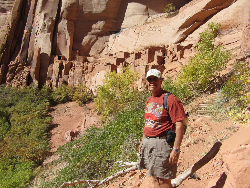 Man standing in Pueblo ruins, Navajo National Monument