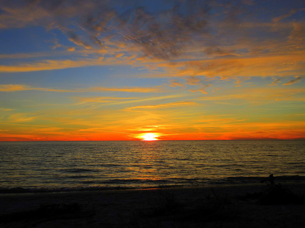 Sun setting over the ocean.