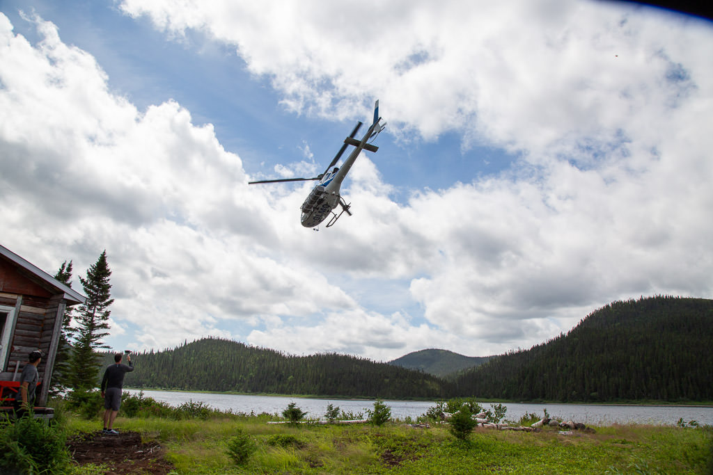 Helicopter flying away from the group.