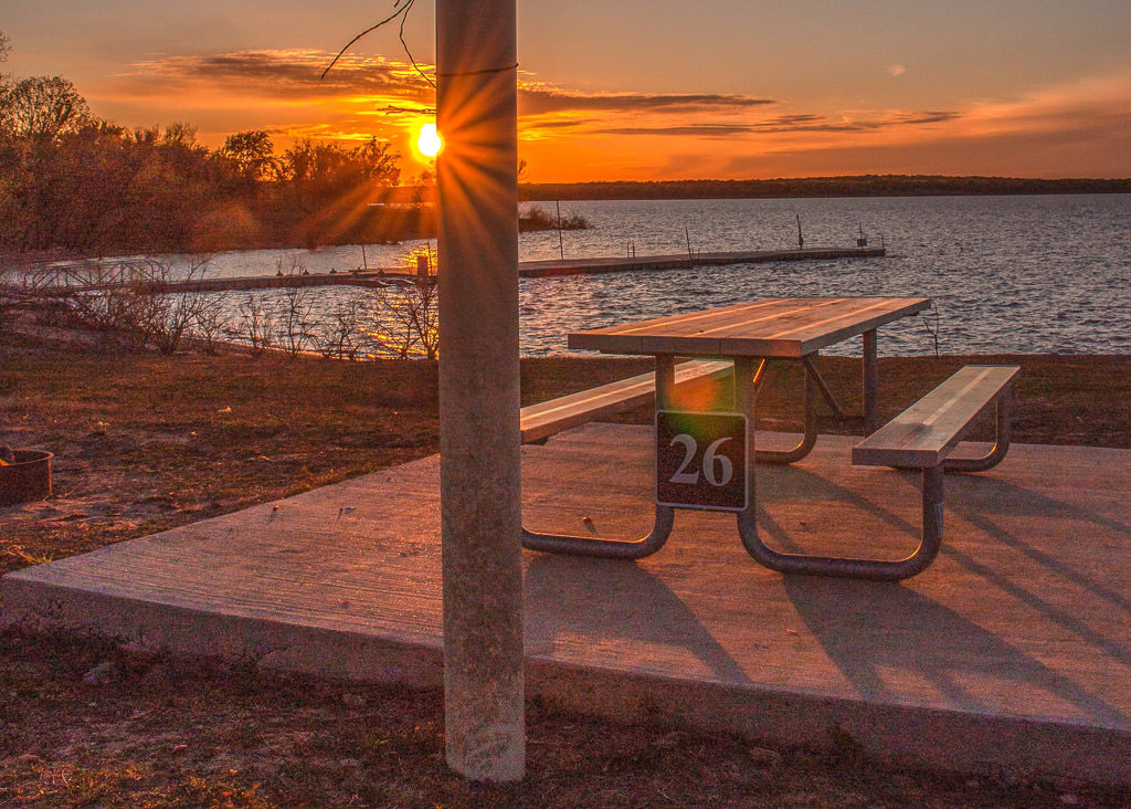 Campsite with picnic table during sunset