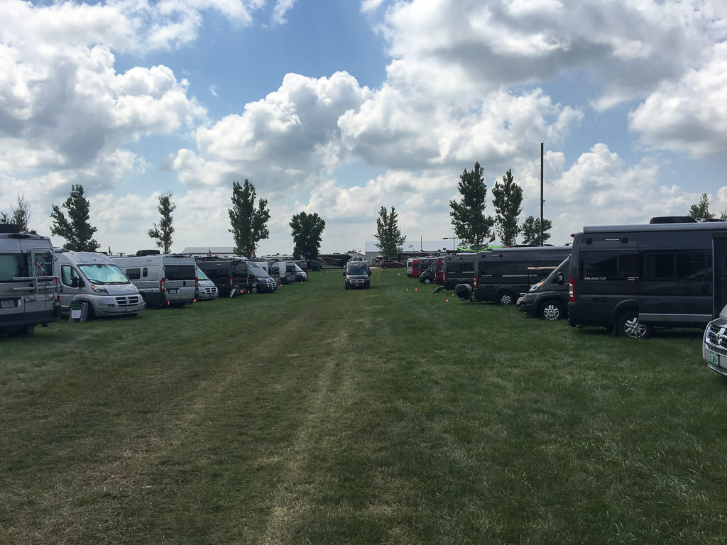 2 rows of Winnebago Class B vans parked at the Winnebago Grand National Rally.