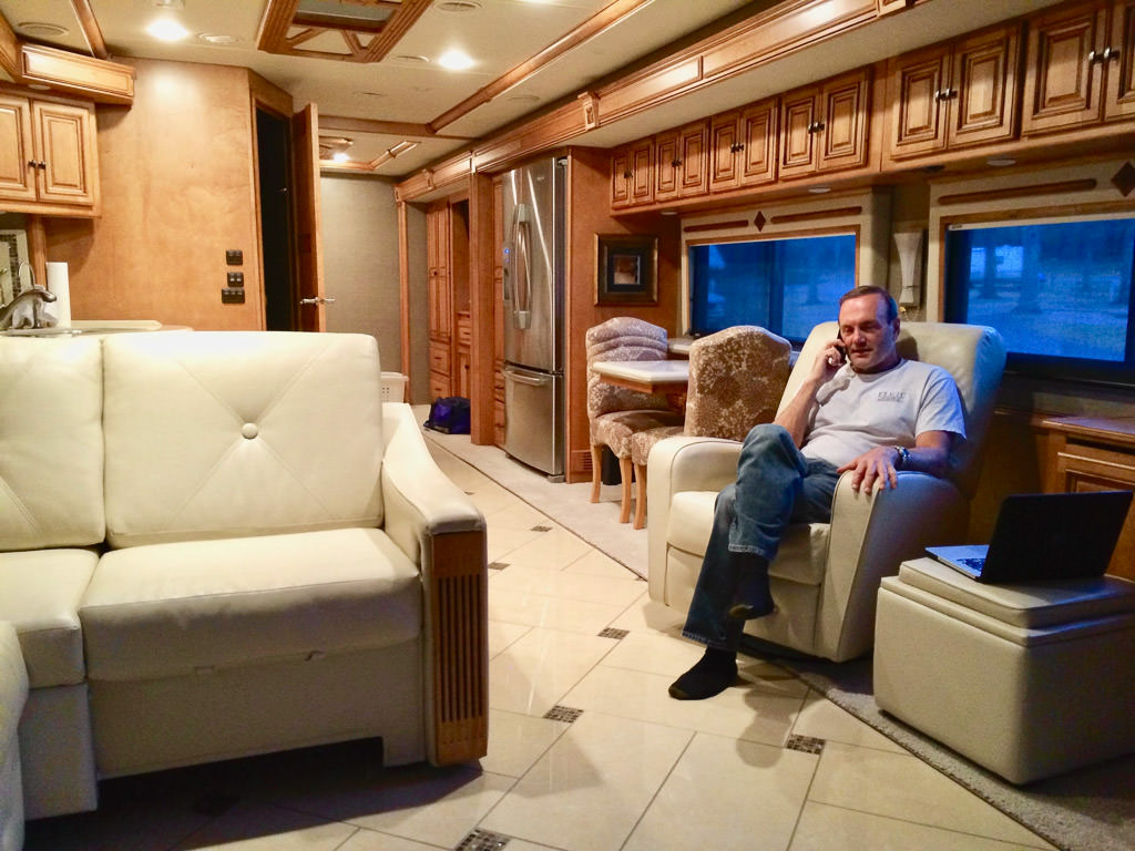 Man sitting in chair in Winnebago Ellipse.