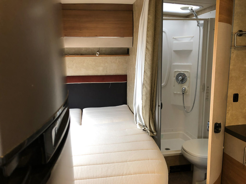 Corner bed and bathroom in Winnebago View.