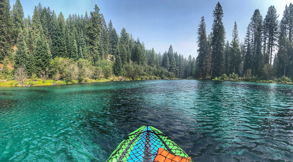 Inflatable kayak cruising down the river