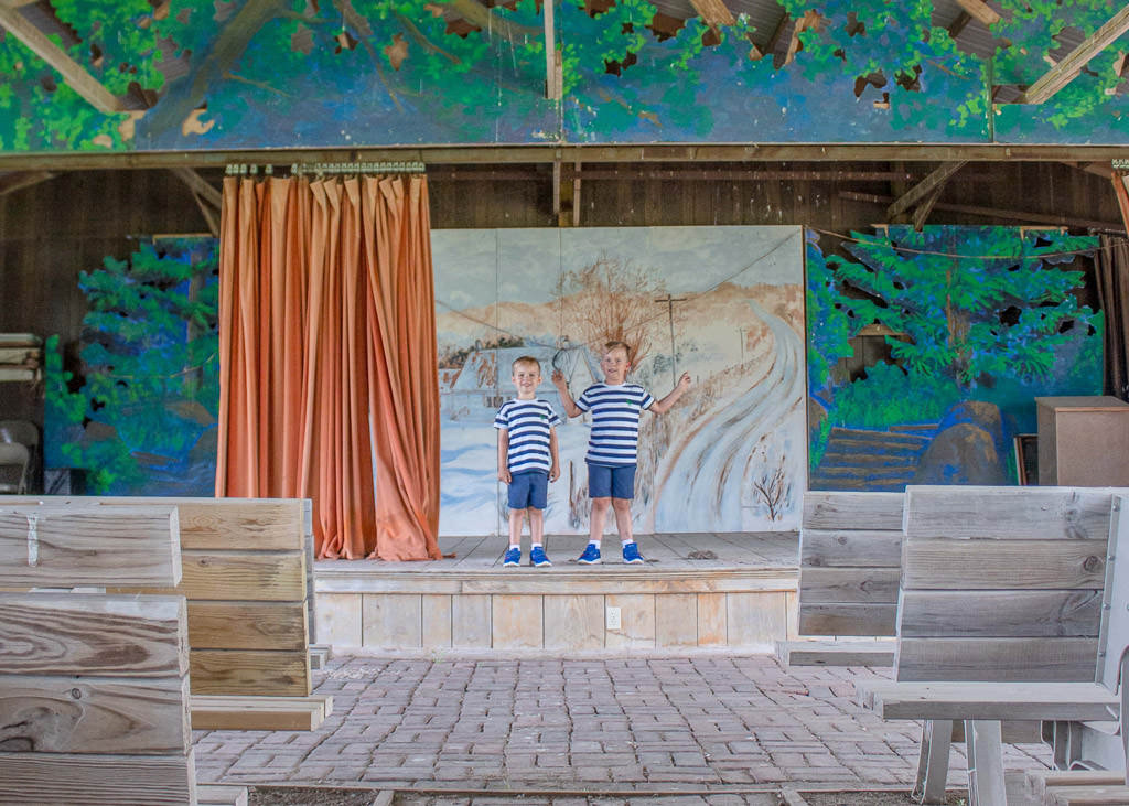 The two boys posing on the stage at the amphitheater